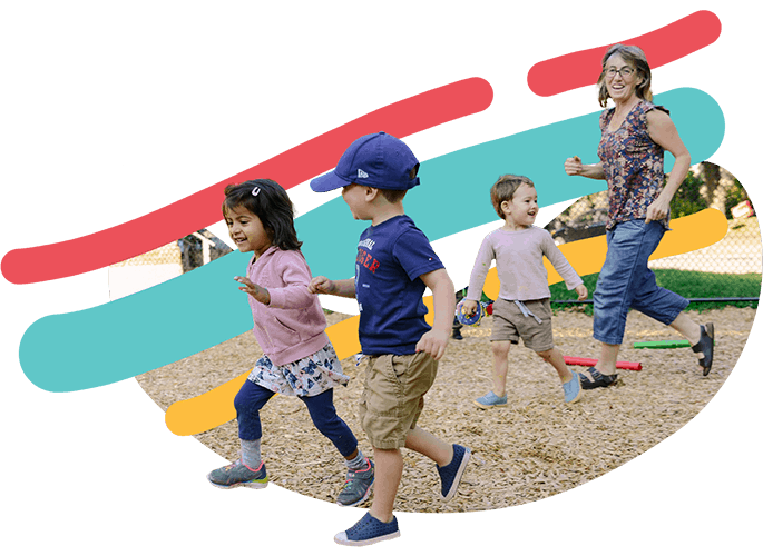 One teachear and three kids running in a playground